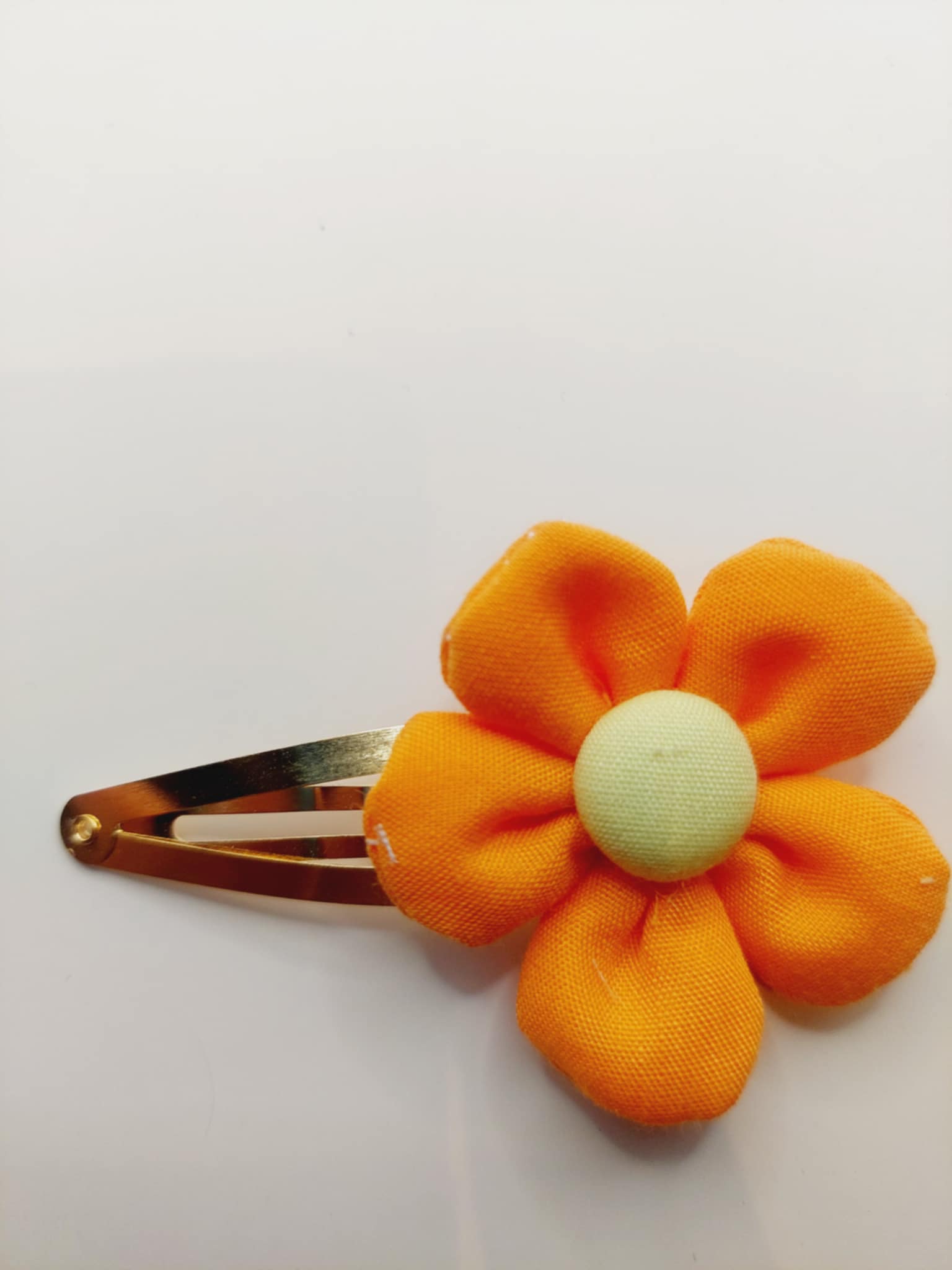 Haarspeld clip van 5 cm met een oranje bloem