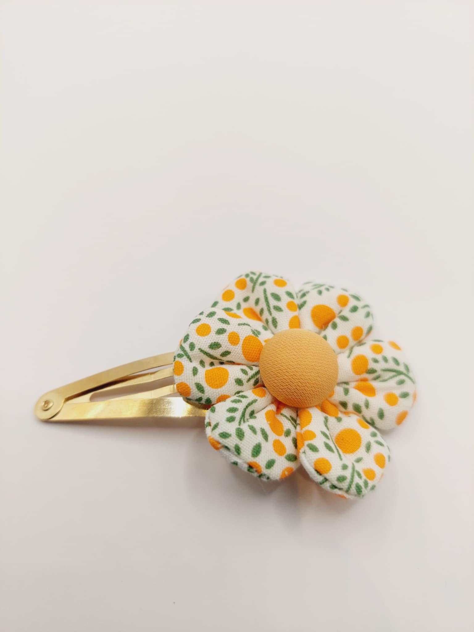 Haarclip met een rubber coating met een oranje bloem