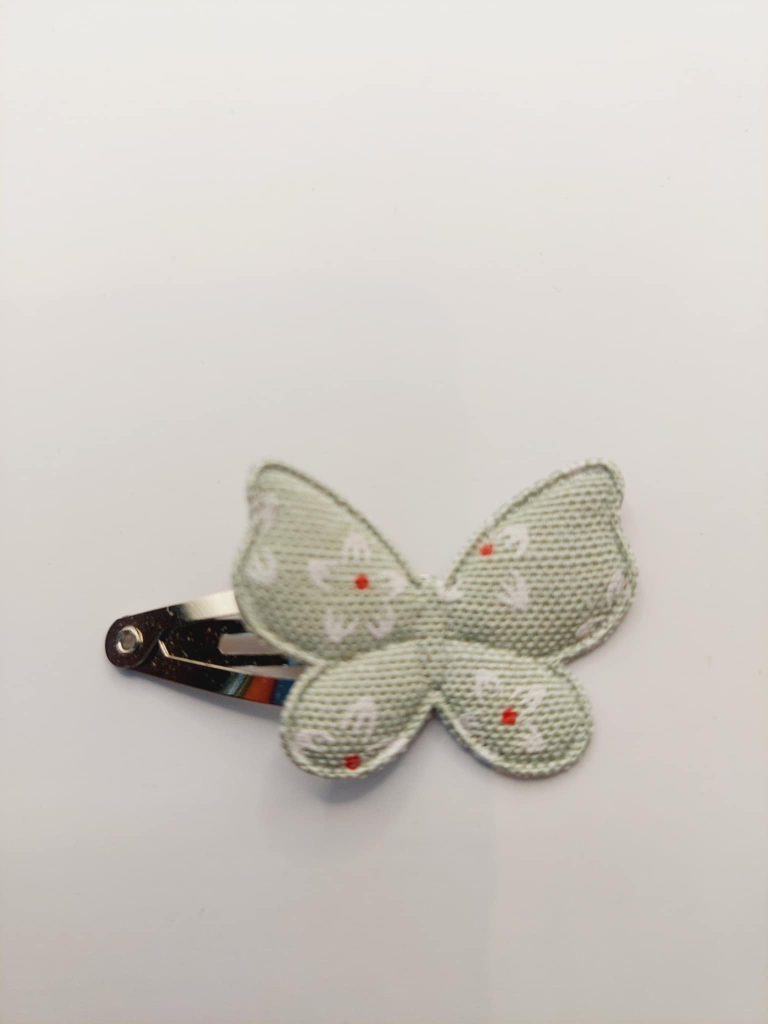 Haarclip van 3 cm met een groene vlinder met bloemmetjes opdruk