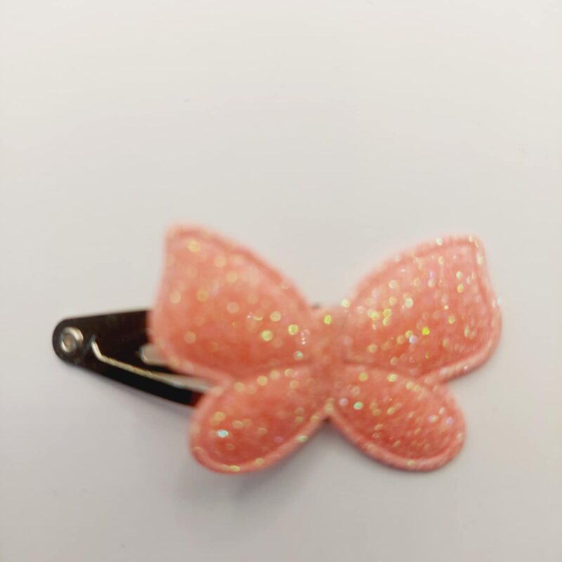 Haarclip van 3 cm met een donker roze vlinder met gliiter