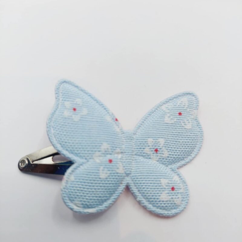 Haarclip van 4 cm met een blauw vlinder met bloemmetjes opdruk