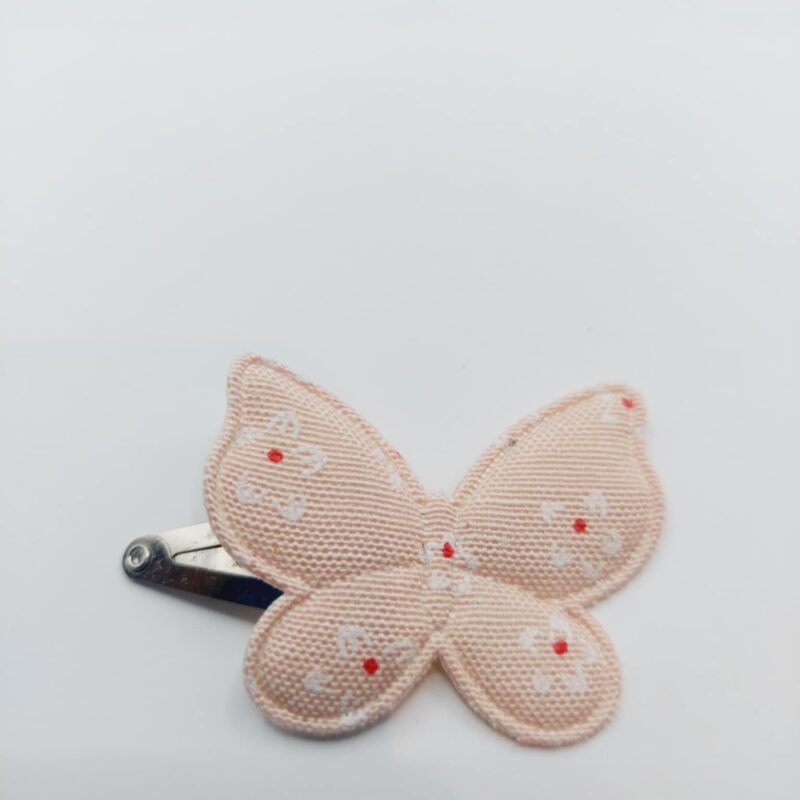 Haarclip van 4 cm met een zalm vlinder met bloemmetjes opdruk