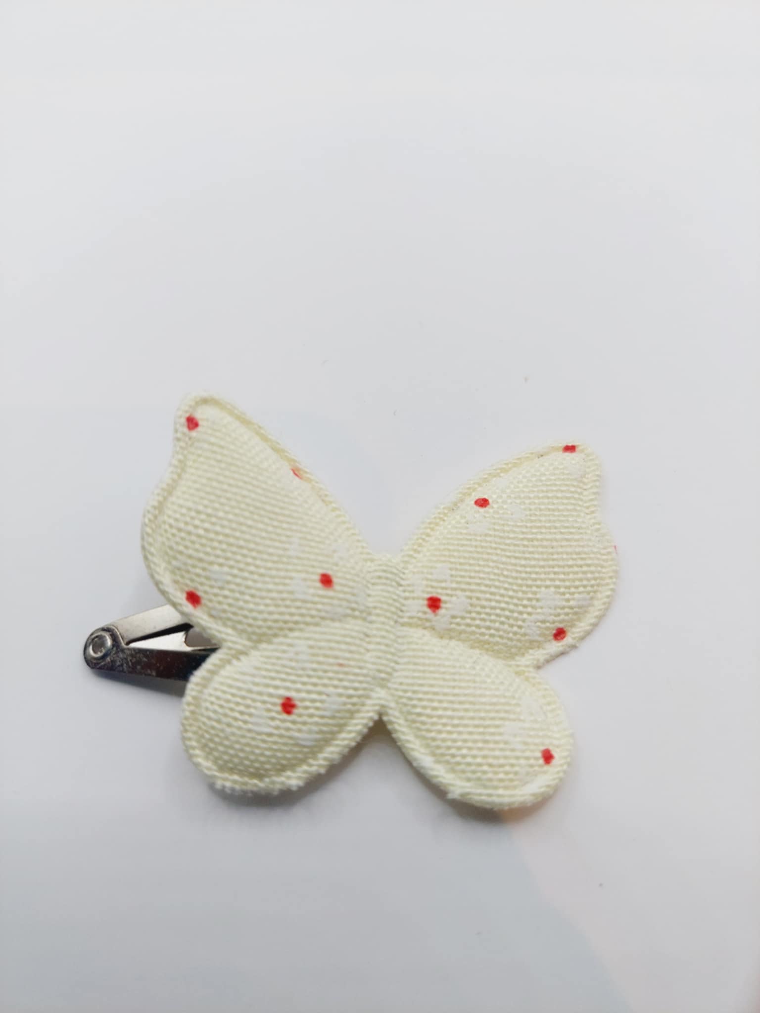 Haarclip van 4 cm met een gele vlinder met bloemmetjes opdruk